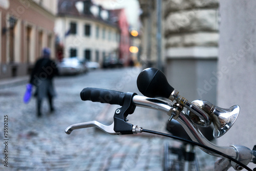 Wheel bicycle with a signal on the streets of the old city backg