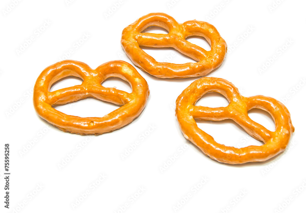 three yummy salted pretzels on white three yummy salted pretzels on white