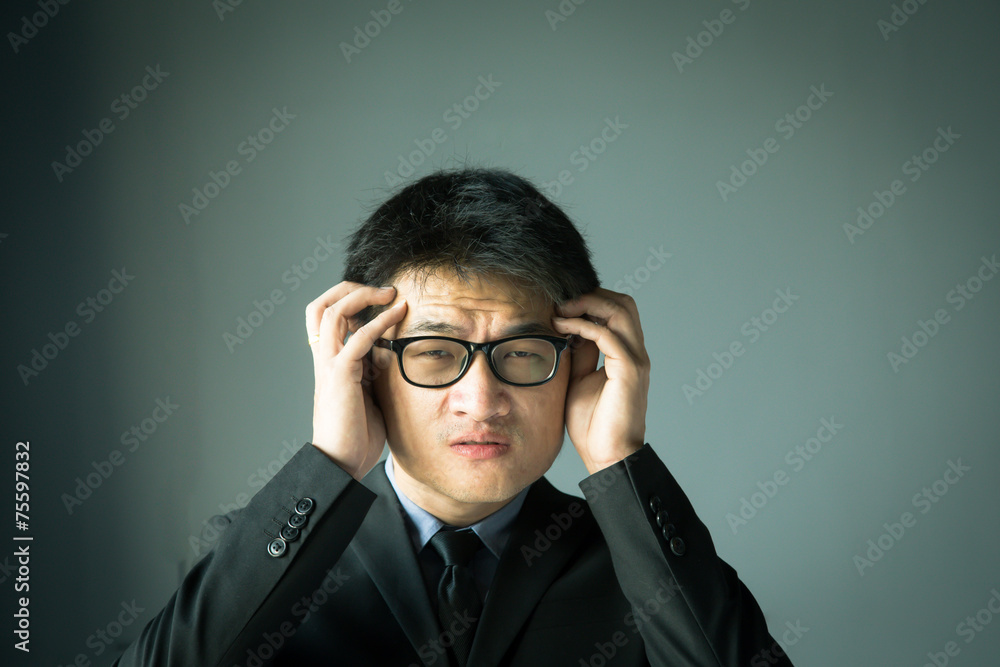 Businessman with stress and holding head Businessman with stress and holding head