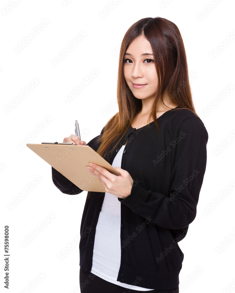 Woman write on clipboard Woman write on clipboard