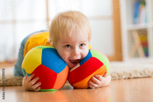 baby boy playing with toy i...