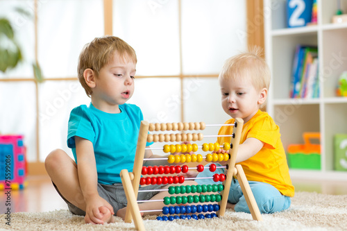 kids playing with abacus
