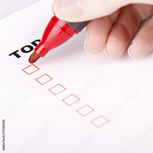 To Do list with woman hand and marker
