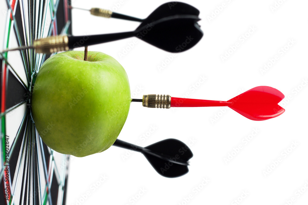 dart hit green apple in the target center dart hit green apple in the target center