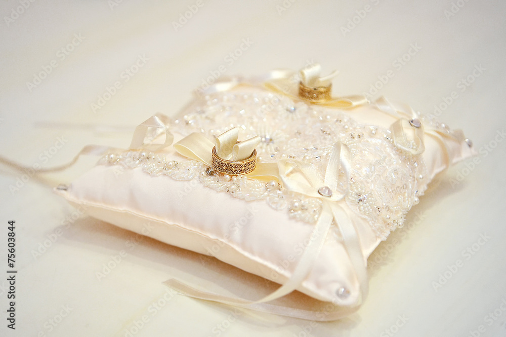 wedding rings on a cushion wedding rings on a cushion