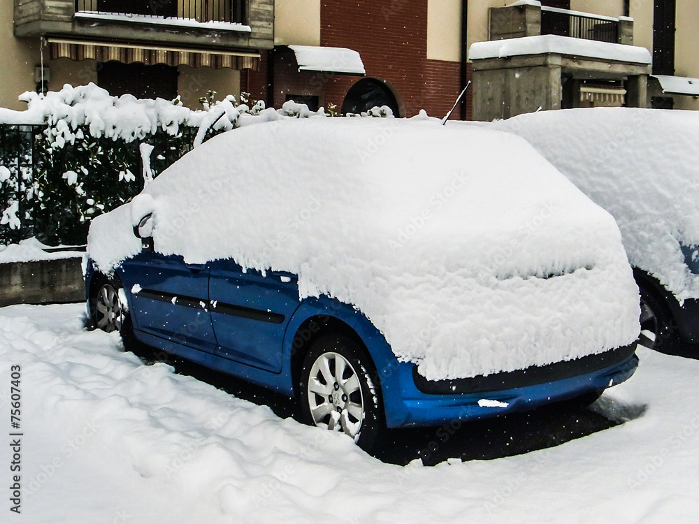 Car covered by snow after a snowfall Car covered by snow after a snowfall