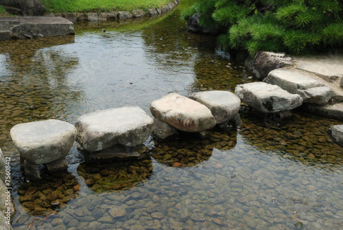 Bridge made of stones in a Japanese garden