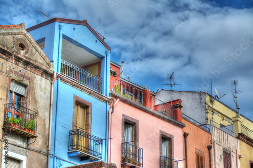 cloudy sky over Bosa colorful facades