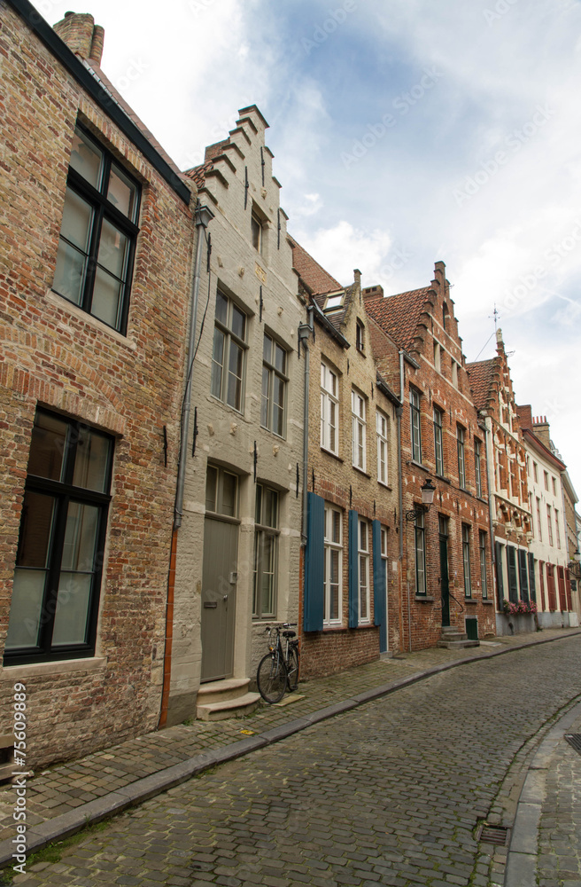 Bruges, Belgium, Flemish old street with bicycle.