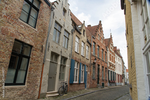 Bruges, Belgium, Flemish old street with bicycle.