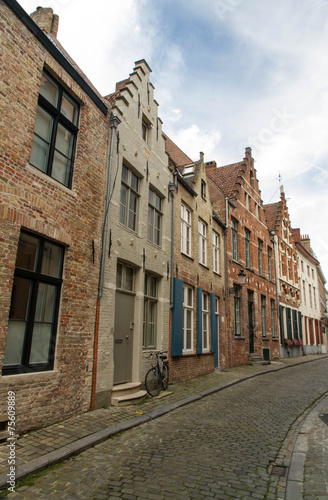 Bruges  Belgium  Flemish old street with bicycle.