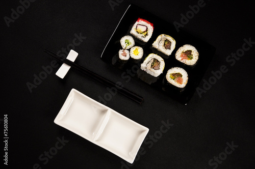 Luxurious sushi on black background - japanese cuisine