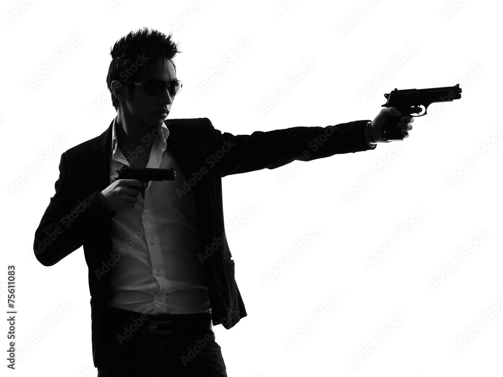 Obraz premium asian gunman killer silhouette