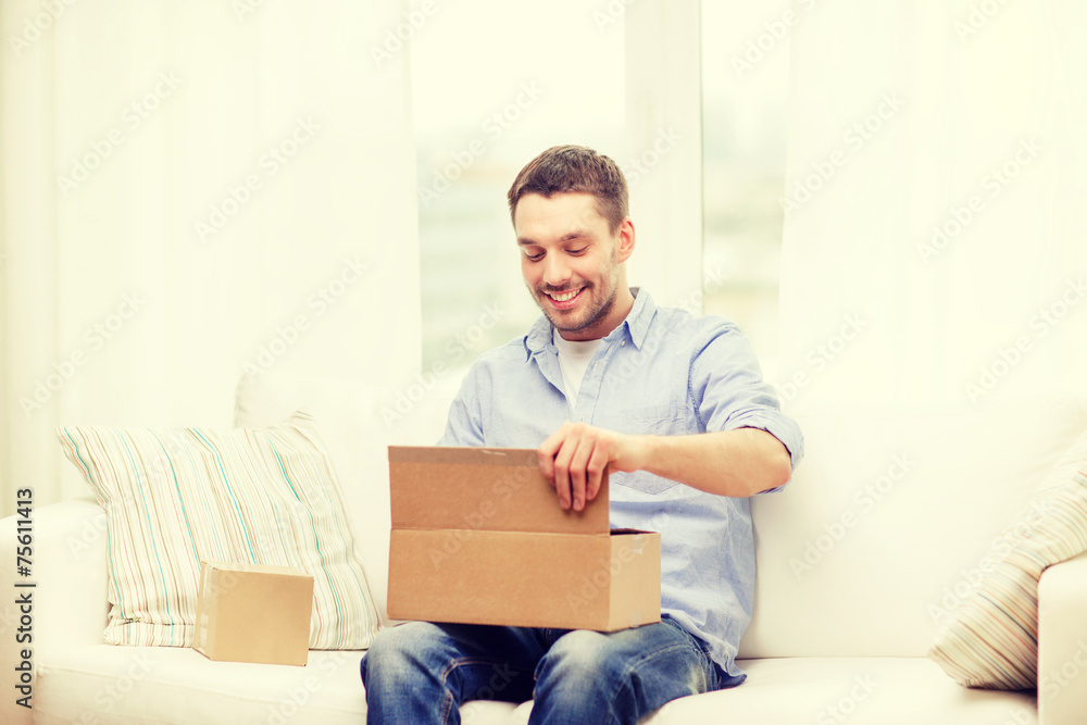 man with cardboard boxes at home man with cardboard boxes at home
