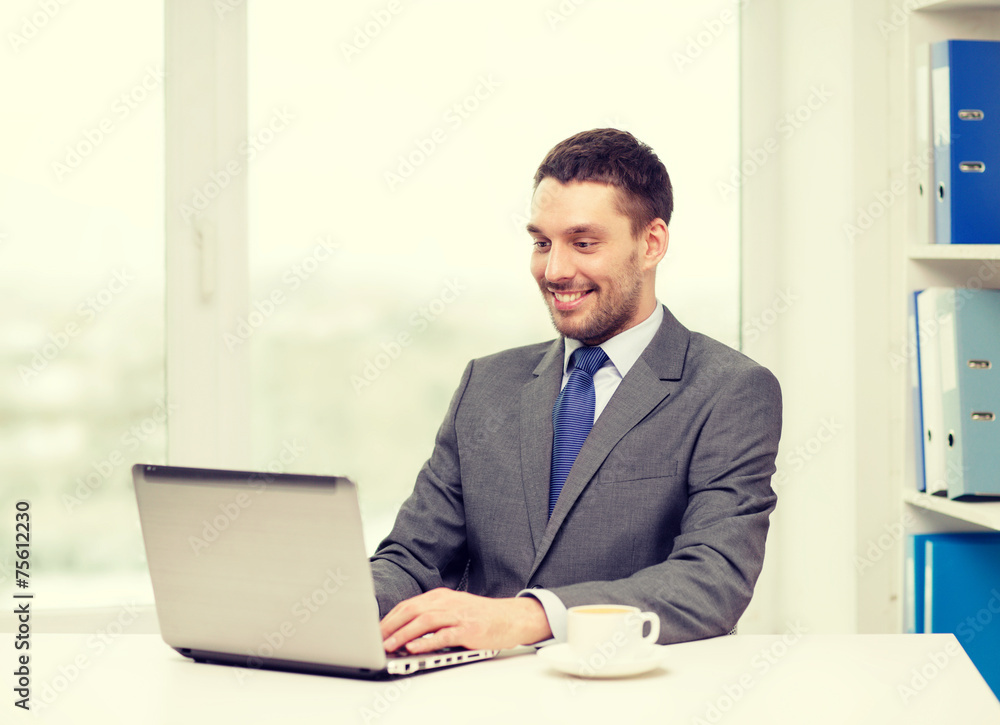 smiling businessman with laptop and coffee smiling businessman with laptop and coffee