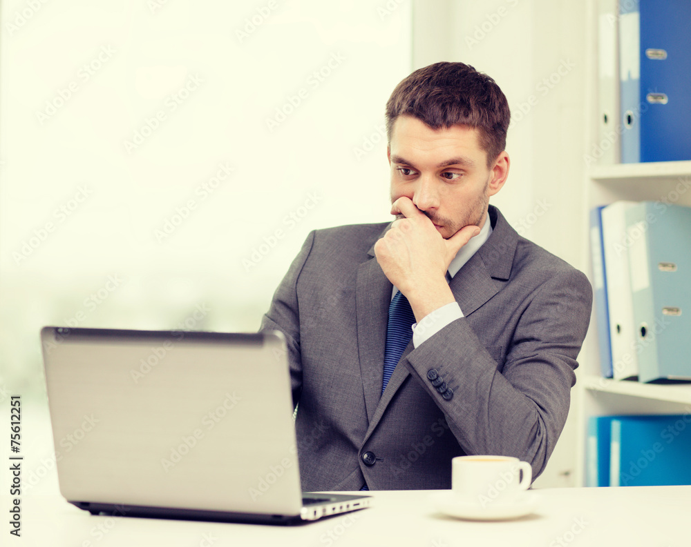 busy businessman with laptop and coffee busy businessman with laptop and coffee