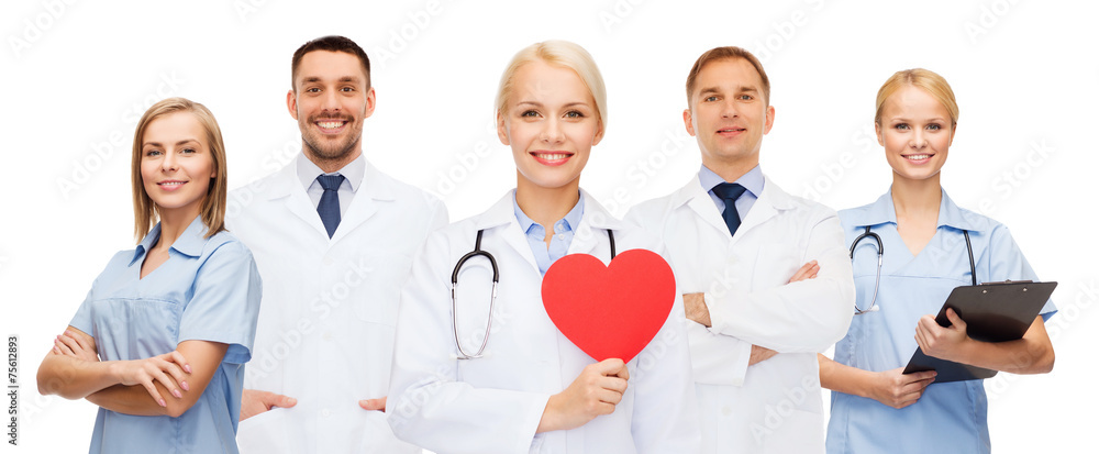 group of smiling doctors with red heart shape