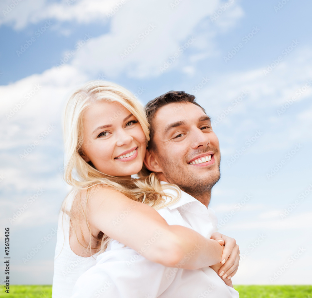 happy couple having fun over poppy flowers field happy couple having fun over poppy flowers field