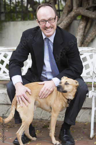 man in suit with a dog