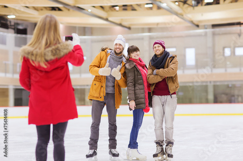 Wallpaper Mural happy friends taking photo on skating rink Torontodigital.ca