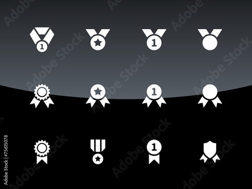 Awards and medal icons on black background.