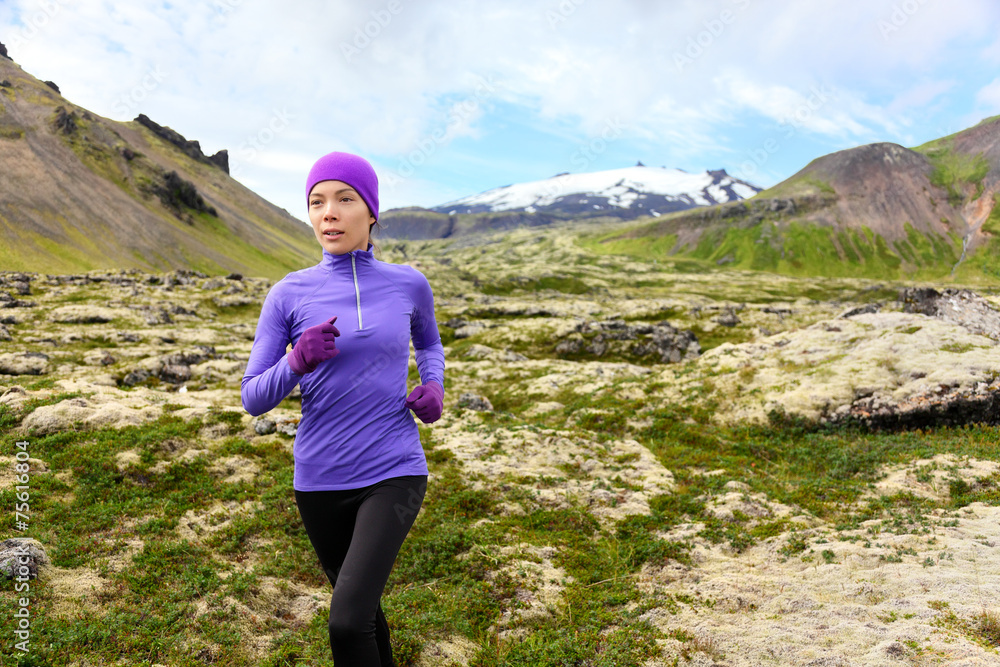 Running woman exercising - trail runner athlete