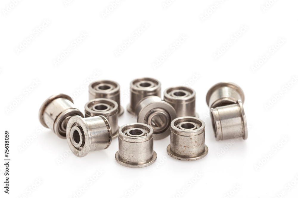 lot of small ball bearings on the white background lot of small ball bearings on the white background