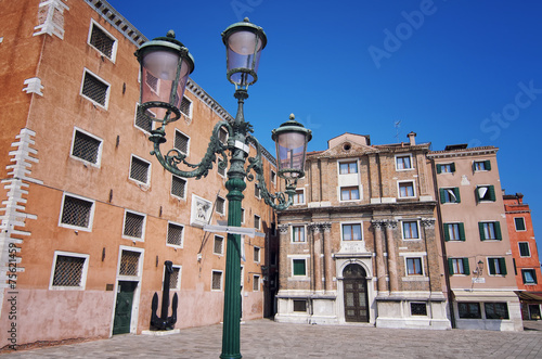 enice, Italy. Street Lamp and Museum building photo