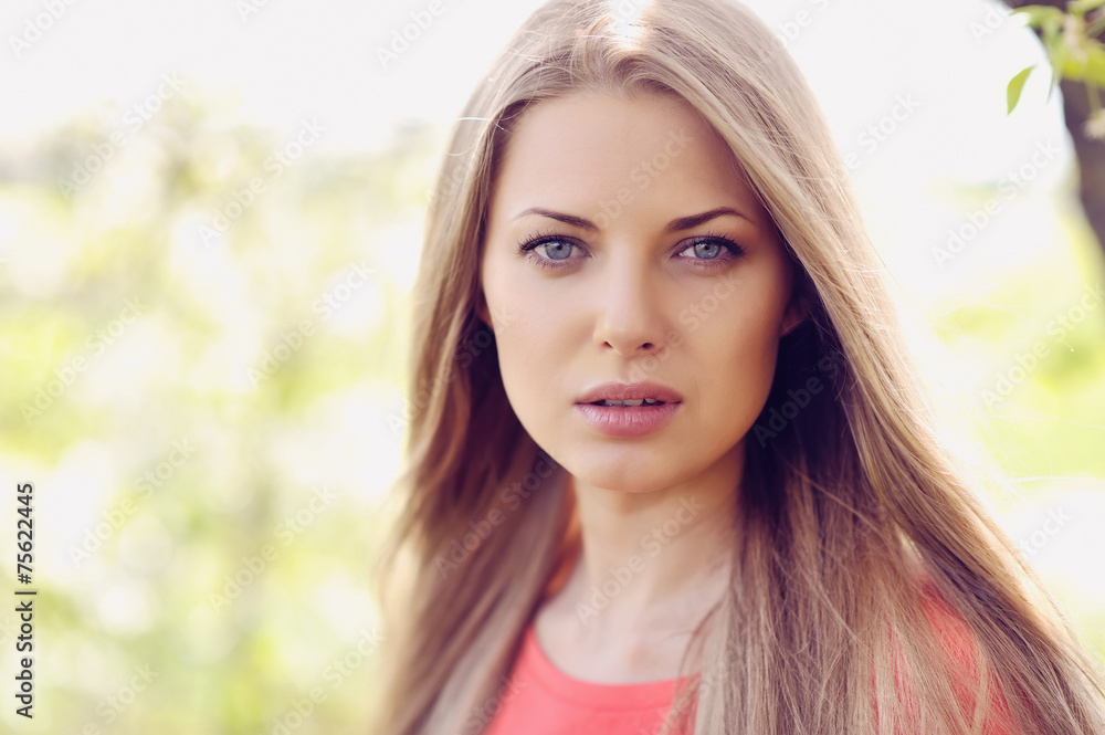 Portrait of beautiful woman in blooming tree in spring Portrait of beautiful woman in blooming tree in spring