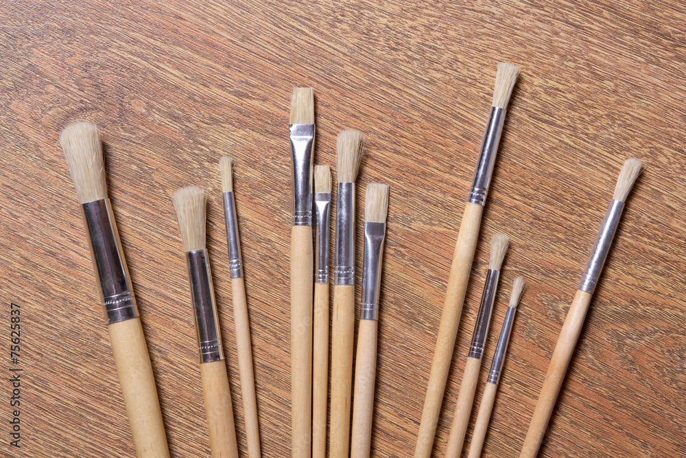 Fototapeta premium close up of paint brushes set on the table