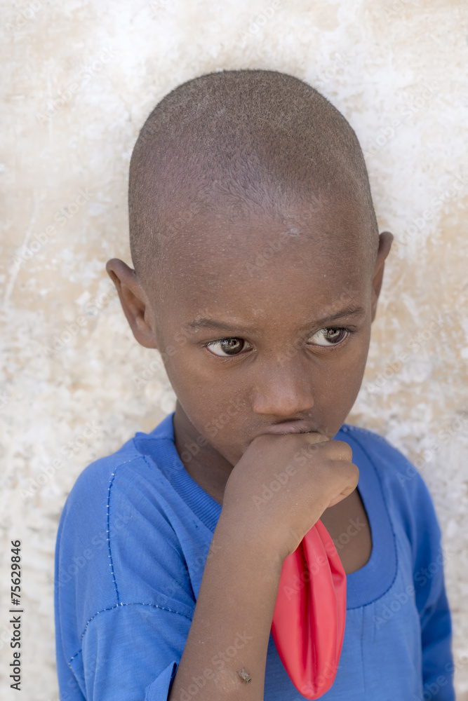 African boy holding a balloon (four years old) African boy holding a balloon (four years old)