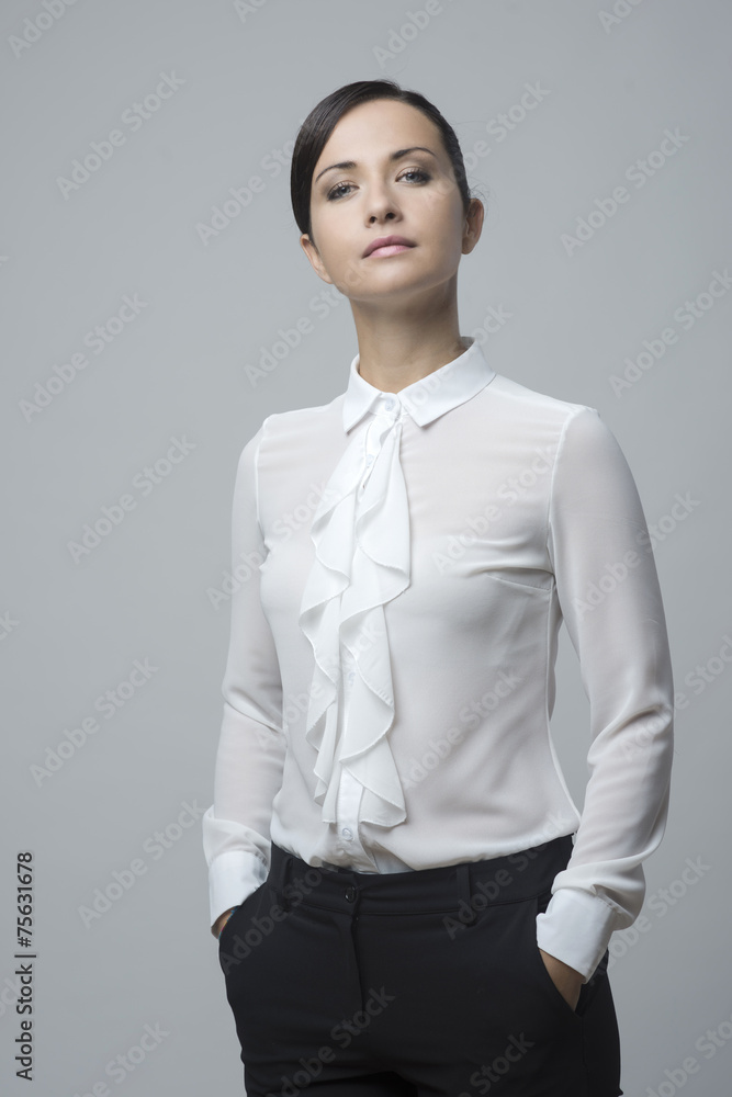 Confident woman hands in pockets