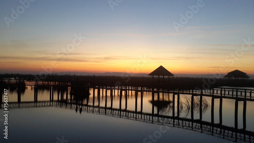 Silhouette pavilion and wooden bridge