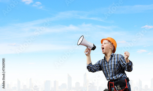 Woman builder with megaphone