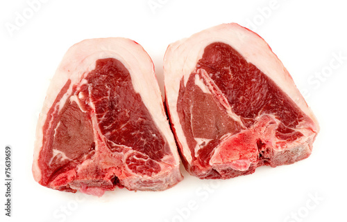 Two cuts of raw uncooked lamb chops