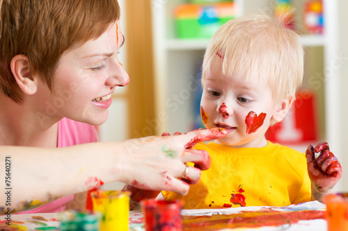 mother and kid have fun wit...