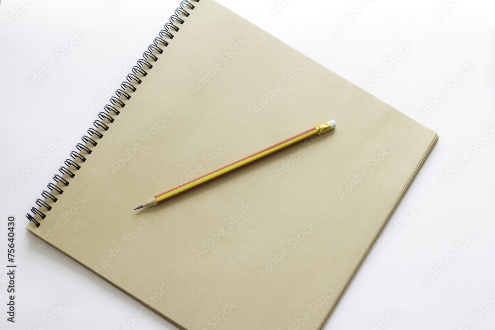 brown notebook and pencil brown notebook and pencil