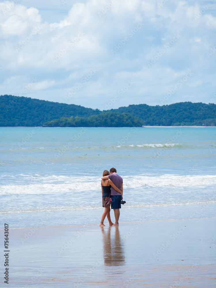 couple walking on the beach in Thailand
