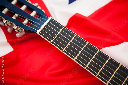 Neck of the guitar on the background of the flag of Britain