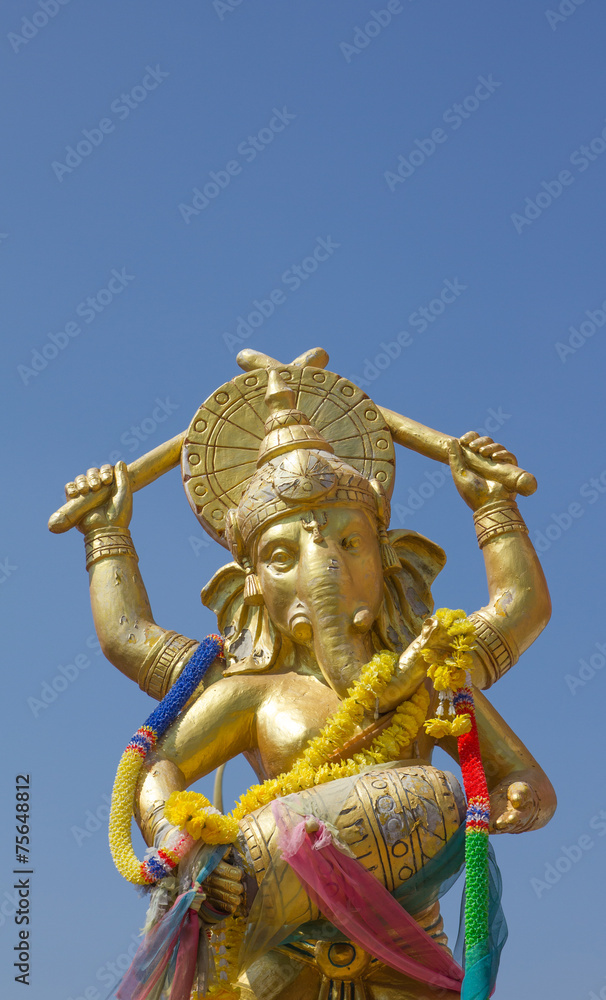 Fototapeta premium Hindu God Gannesa glod blue sky background