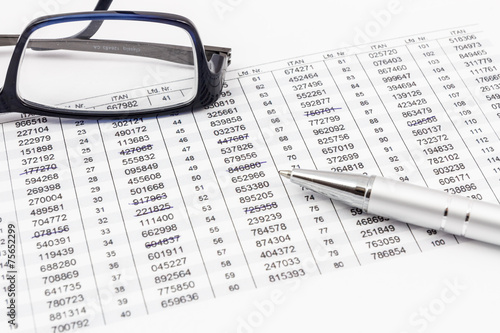 Glasses, ballpoint pen and TAN list for online banking photo