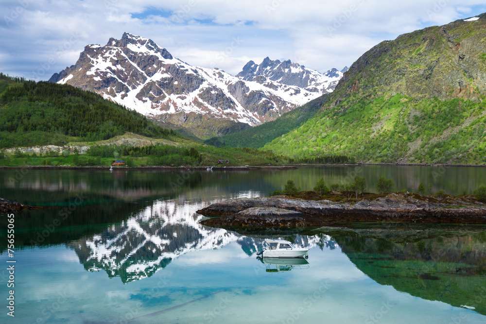 Fototapeta premium Small fishing boat in scenic fjord on Lofoten, Norway