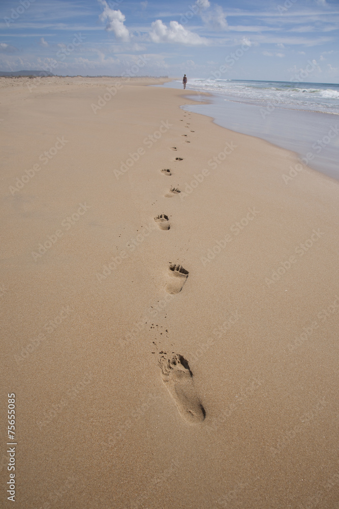 far woman walking at beach far woman walking at beach