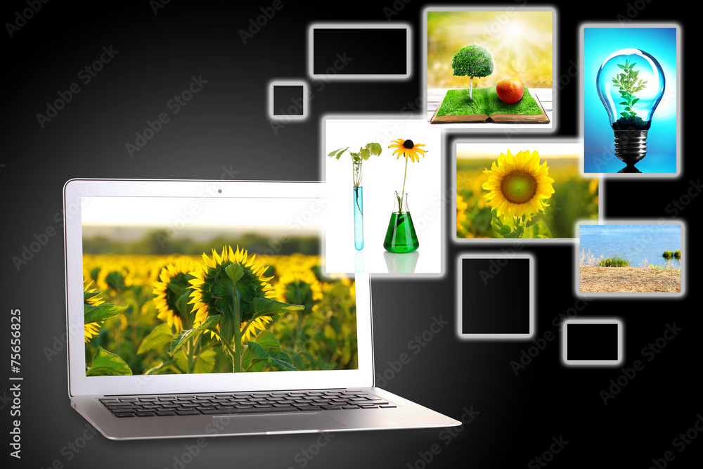 Laptop and eco theme images on dark grey background Laptop and eco theme images on dark grey background