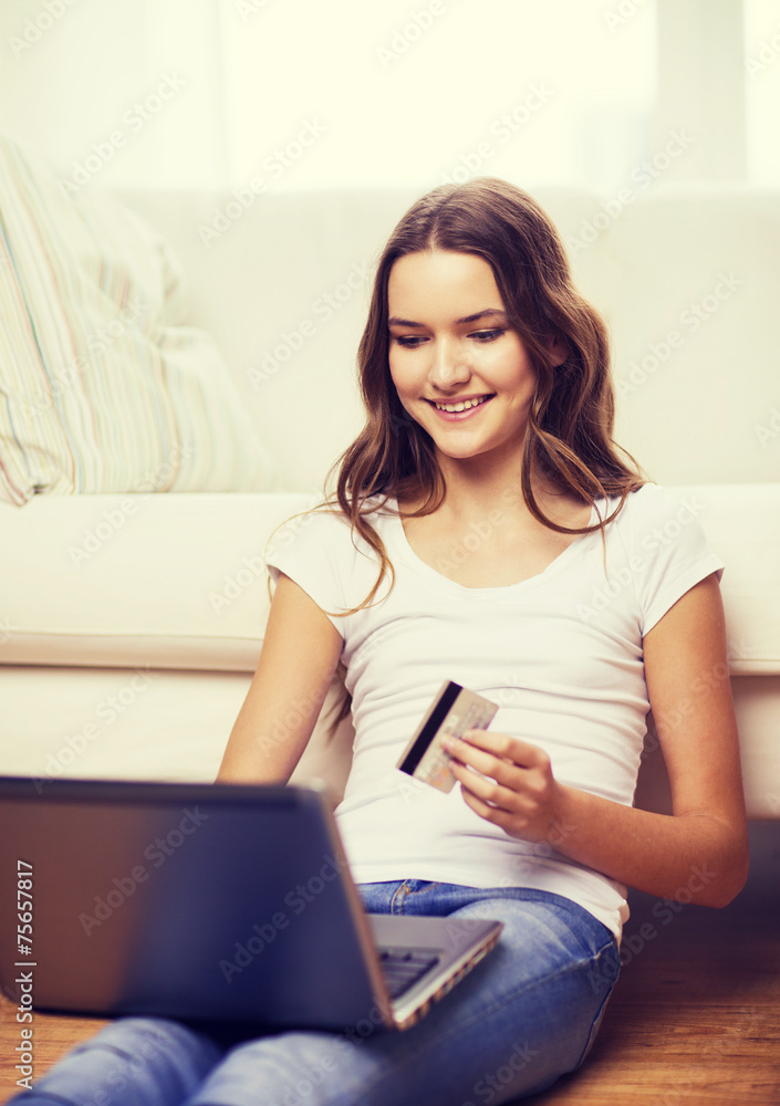 smiling teenage girl with laptop and credit card smiling teenage girl with laptop and credit card