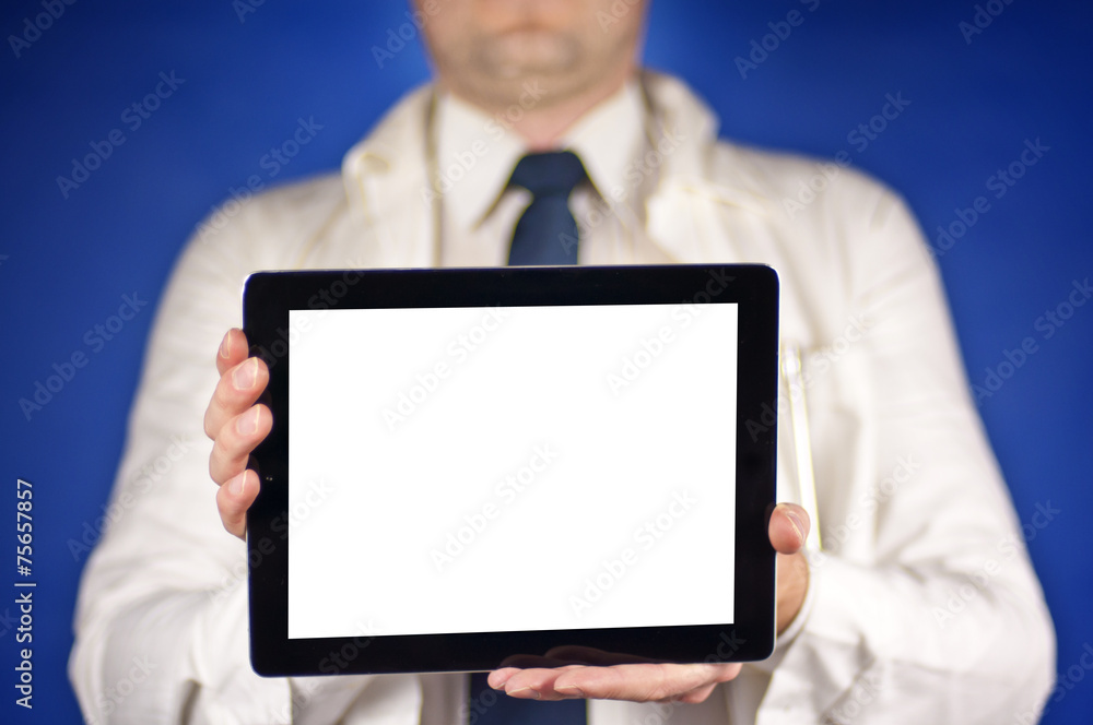 Modern doctor wearing tie showing blank tablet screen Modern doctor wearing tie showing blank tablet screen