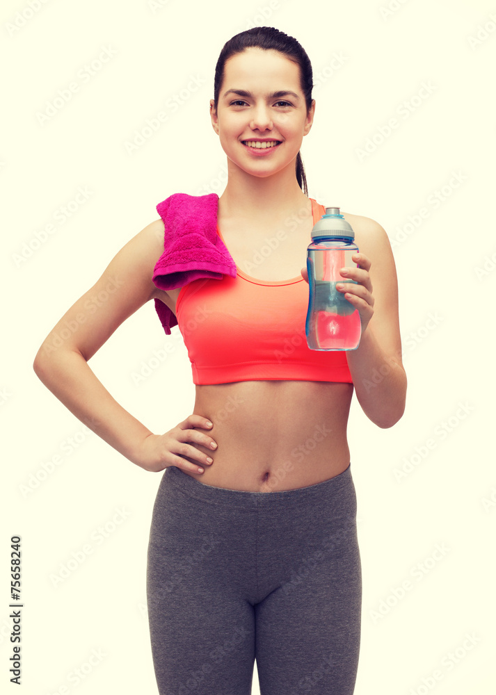 sporty woman with towel and water bottle sporty woman with towel and water bottle