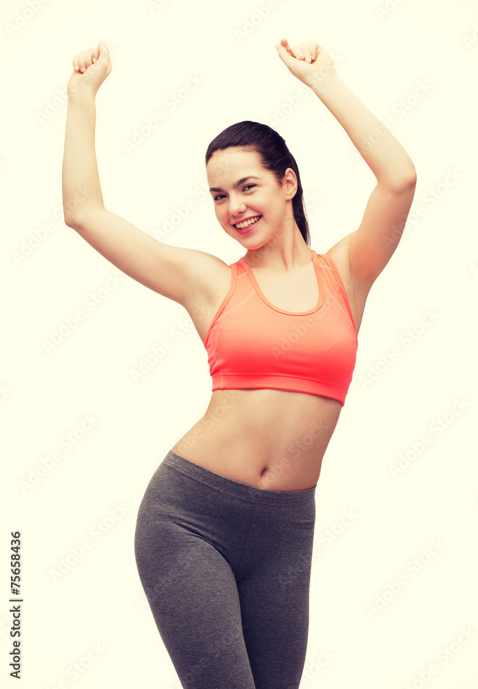 smiling teenage girl in sportswear dancing smiling teenage girl in sportswear dancing