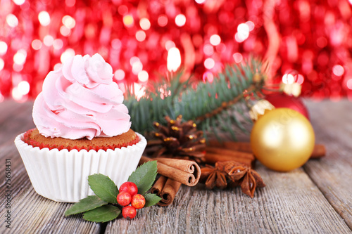 Cup-cake with cream and Christmas decoration