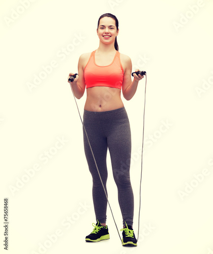 sporty woman with with skipping rope